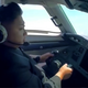 Illustration for article titled Watch the almighty Kim Jong-un allegedly flying a plane by himself